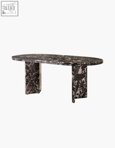 Elegant oval dining table with dark black veined marble top and matching pedestal legs perfect for marble dining
