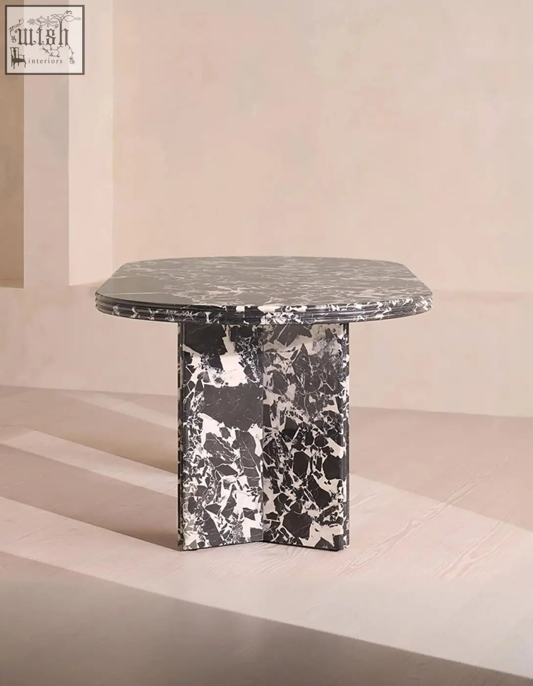 Rosaline black marble dining table with a sleek oval black and white marble top and base perfect for marble dining