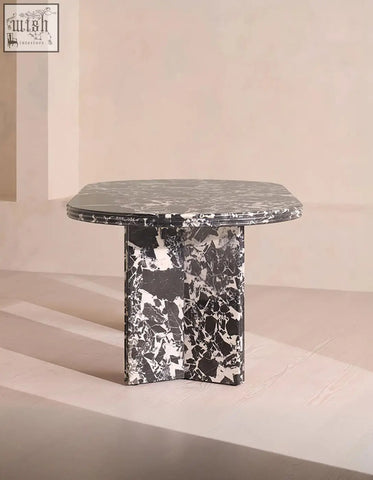 Rosaline black marble dining table with a sleek oval black and white marble top and base perfect for marble dining