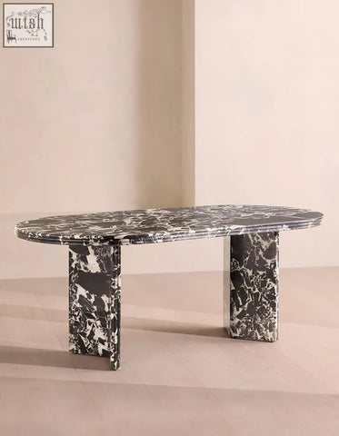 Elegant oval rosaline black marble dining table with a striking black and white marble top and pedestal legs