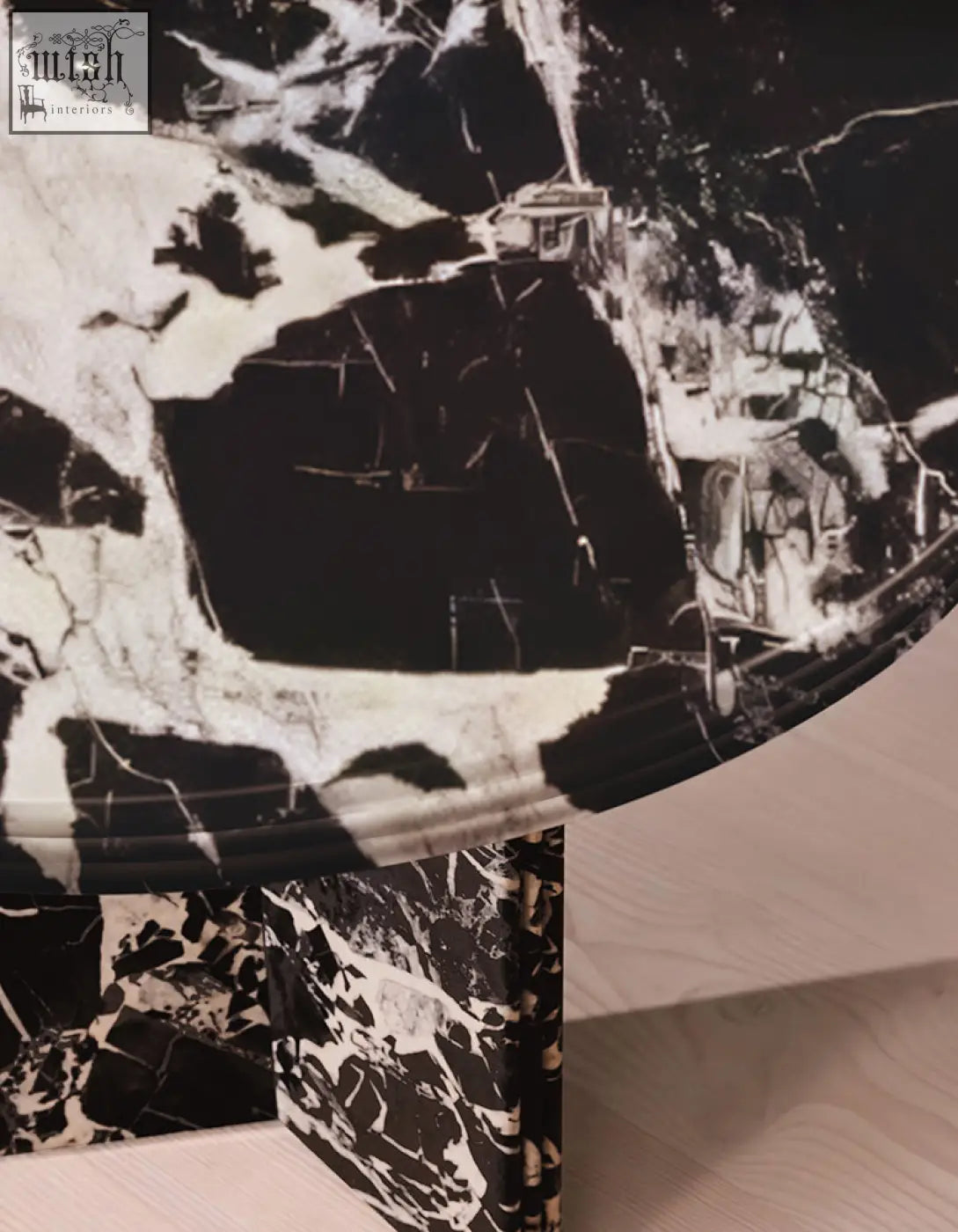 Rosaline black marble dining table with an oval shape and black and white marble pattern perfect for marble dining