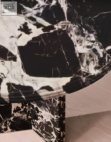 Rosaline black marble dining table with an oval shape and black and white marble pattern perfect for marble dining