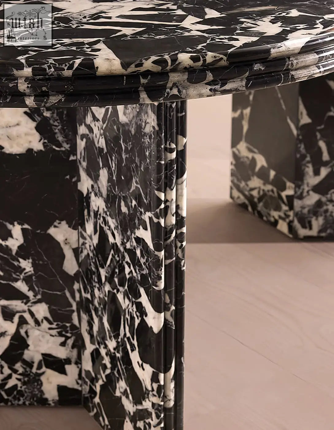 Rosaline black marble dining table oval with sleek modern design in black and white marble perfect for dining room