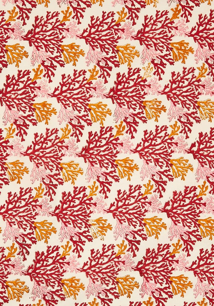 Rose coral tablecloth with vibrant coral-themed red orange and pink branching patterns on a soft cream fabric