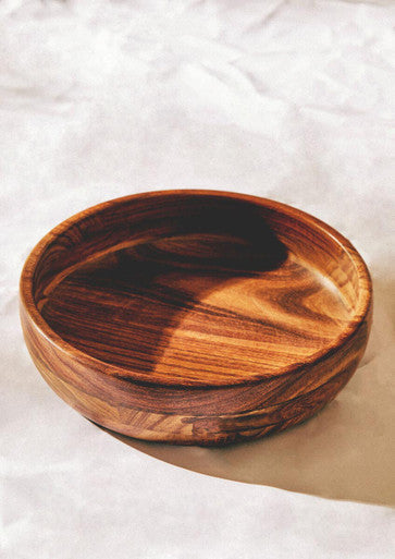 A handcrafted rosi round sheesham wooden bowl with warm brown finish and natural wood grain patterns perfect for salad