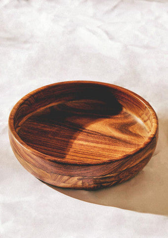 A handcrafted rosi round sheesham wooden bowl with warm brown finish and natural wood grain patterns perfect for salad