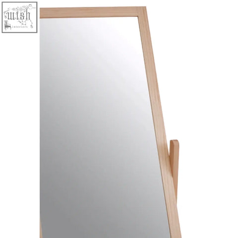 Rostok mirror stand is a standing mirror with a light wood frame and contemporary design featuring a large drawer