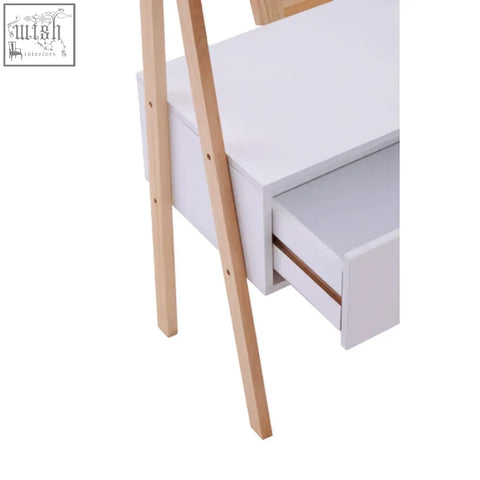 White rostok mirror stand desk with light wood legs and a large drawer partially open in a contemporary design