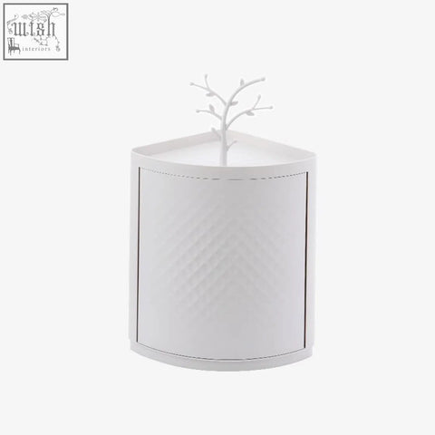White textured corner cabinet with tree ornament on top for rotatable bathroom makeup organizer storing items