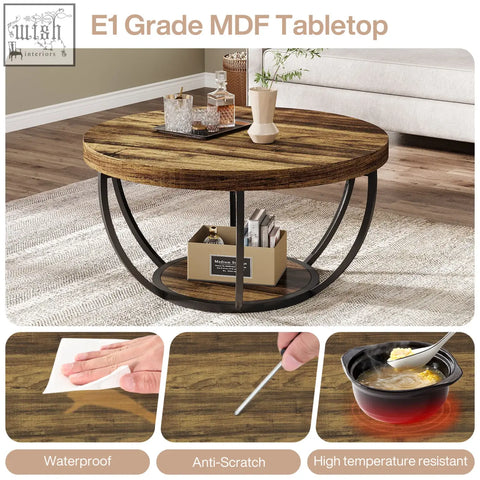 Round coffee table with rustic dark brown wood grain top and sleek black metal circular legs perfect for living rooms