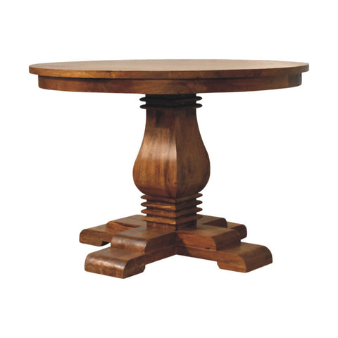 Rich mahogany round pedestal dining table with turned base and ornate carved feet perfect for dining rooms