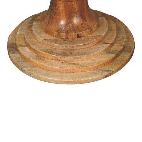 Round turned dining table with reclaimed wood pedestal base featuring concentric circular tiers and warm natural finish
