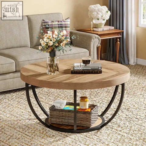 Round wooden coffee table with black metal frame and 2-tier shelves holding a woven basket on the lower shelf