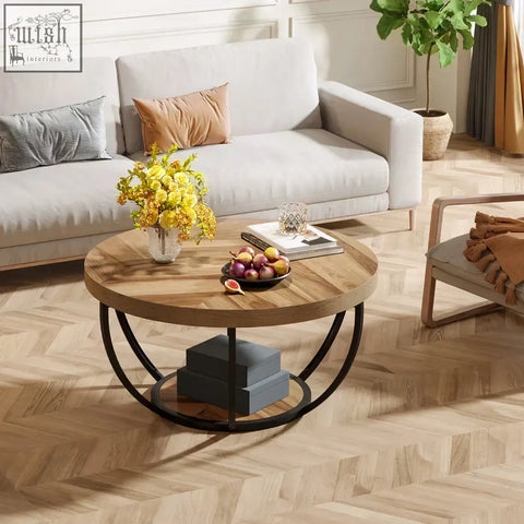 Round wooden coffee table with black metal circular base and 2-tier shelves for stylish living room use