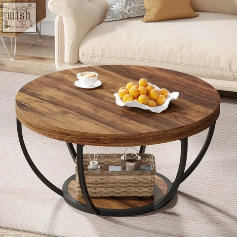 Round wooden coffee table with dark wood top black metal legs and open shelf holding woven basket