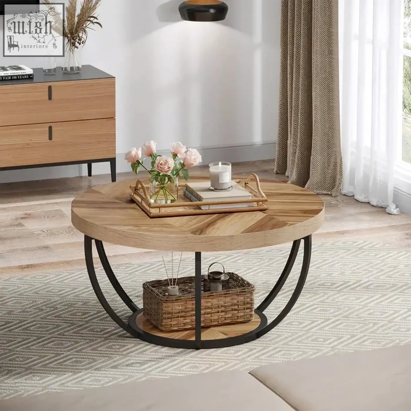 Round wooden coffee table with herringbone pattern top, black metal legs, and open lower shelf for storage