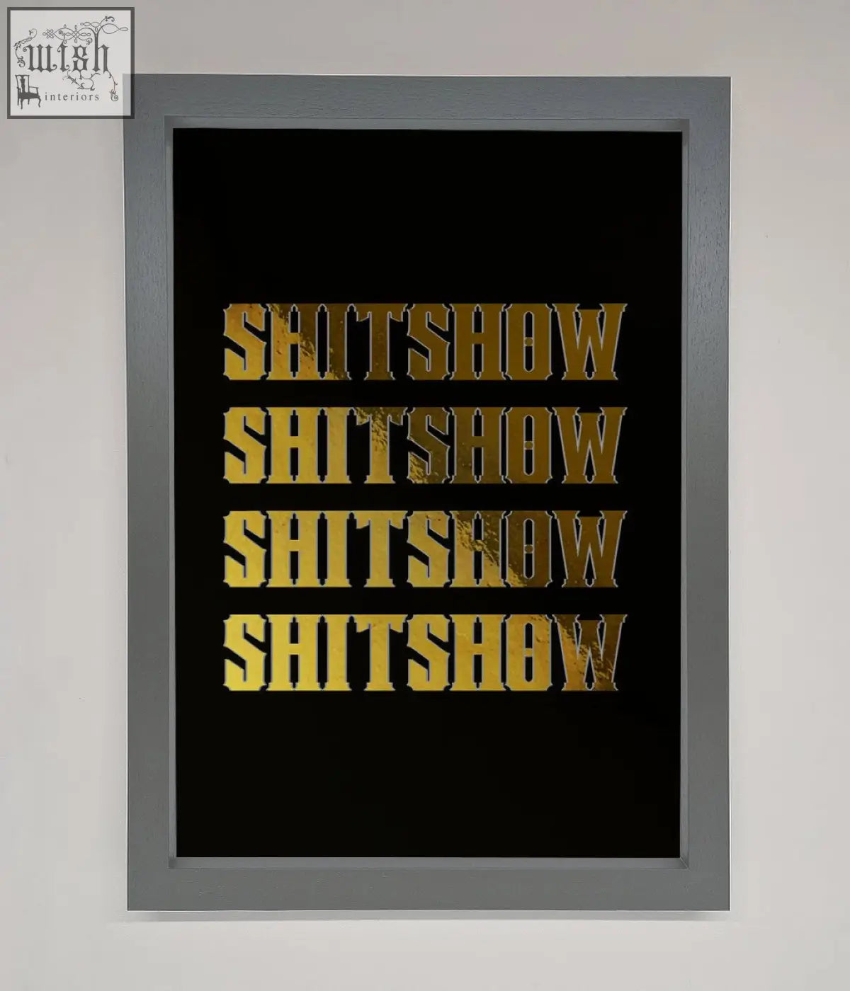 A framed rude quote foil print with the word shitshow repeated in bold textured gold on a black background