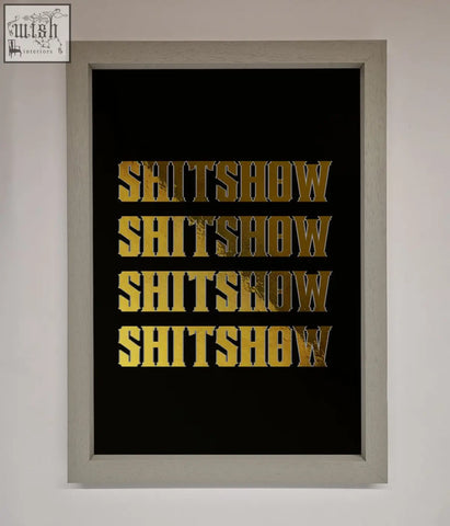 A framed rude quote foil print with the word shitshow in bold textured gold lettering repeated four times on black