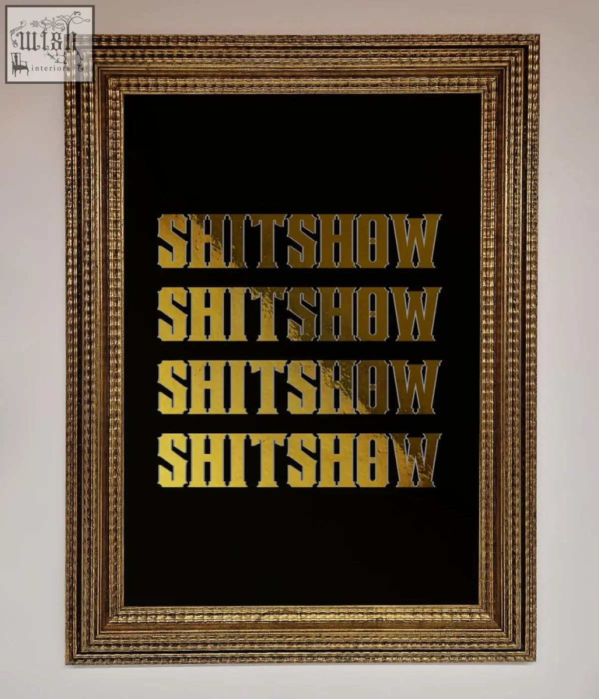 Gold-framed rude quote foil print with the word shitshow repeated in bold textured gold lettering on black background