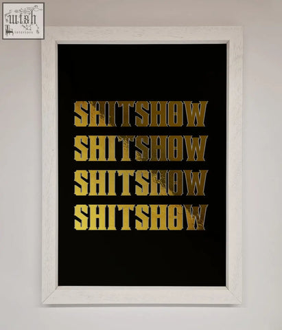A framed black rude quote foil print featuring bold gold foil lettering with the word shitshow repeated four times