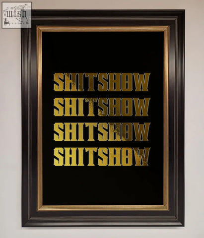 Black framed rude quote foil print with gold foil lettering spelling shitshow in bold blocky font repeated four times
