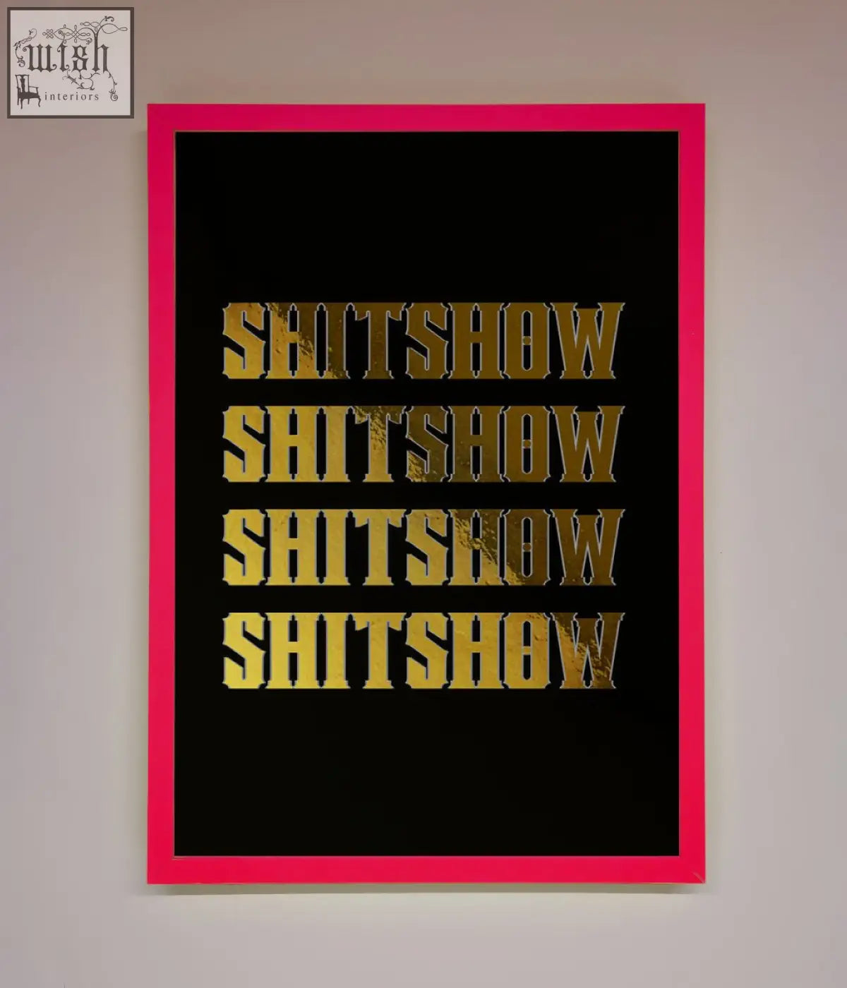 A bold rude quote foil print featuring the word shitshow in textured gold on black with a pink frame