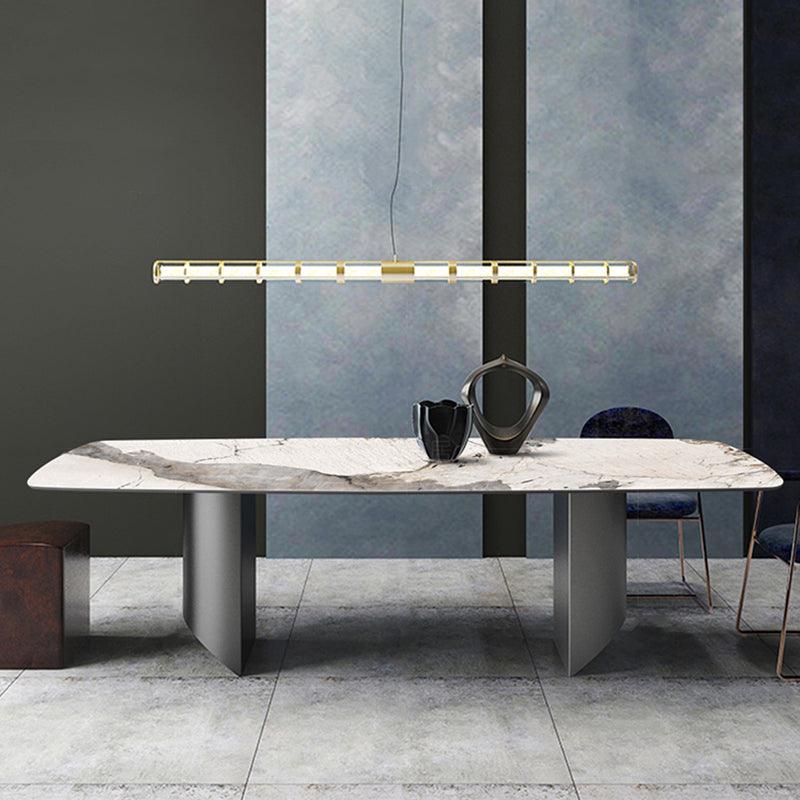Modern rupert dining table with white marble top and gray veining on sleek minimalist metal legs
