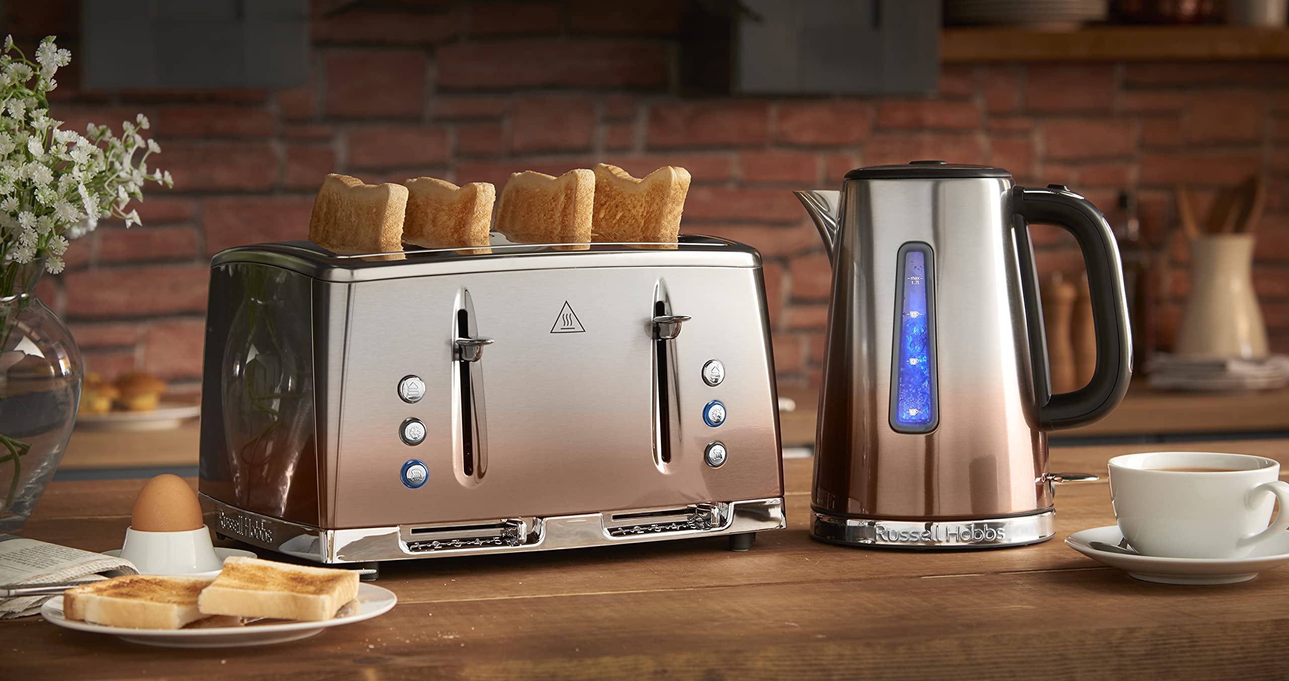 Stainless steel four slice toaster with sleek modern design and blue illuminated controls by russell hobbs eclipse
