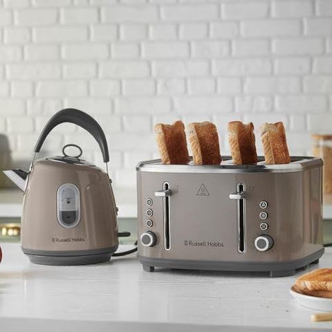 Silver russell hobbs four slice toaster with bread popping alongside stainless steel russell hobbs kettle with perfect pour spout