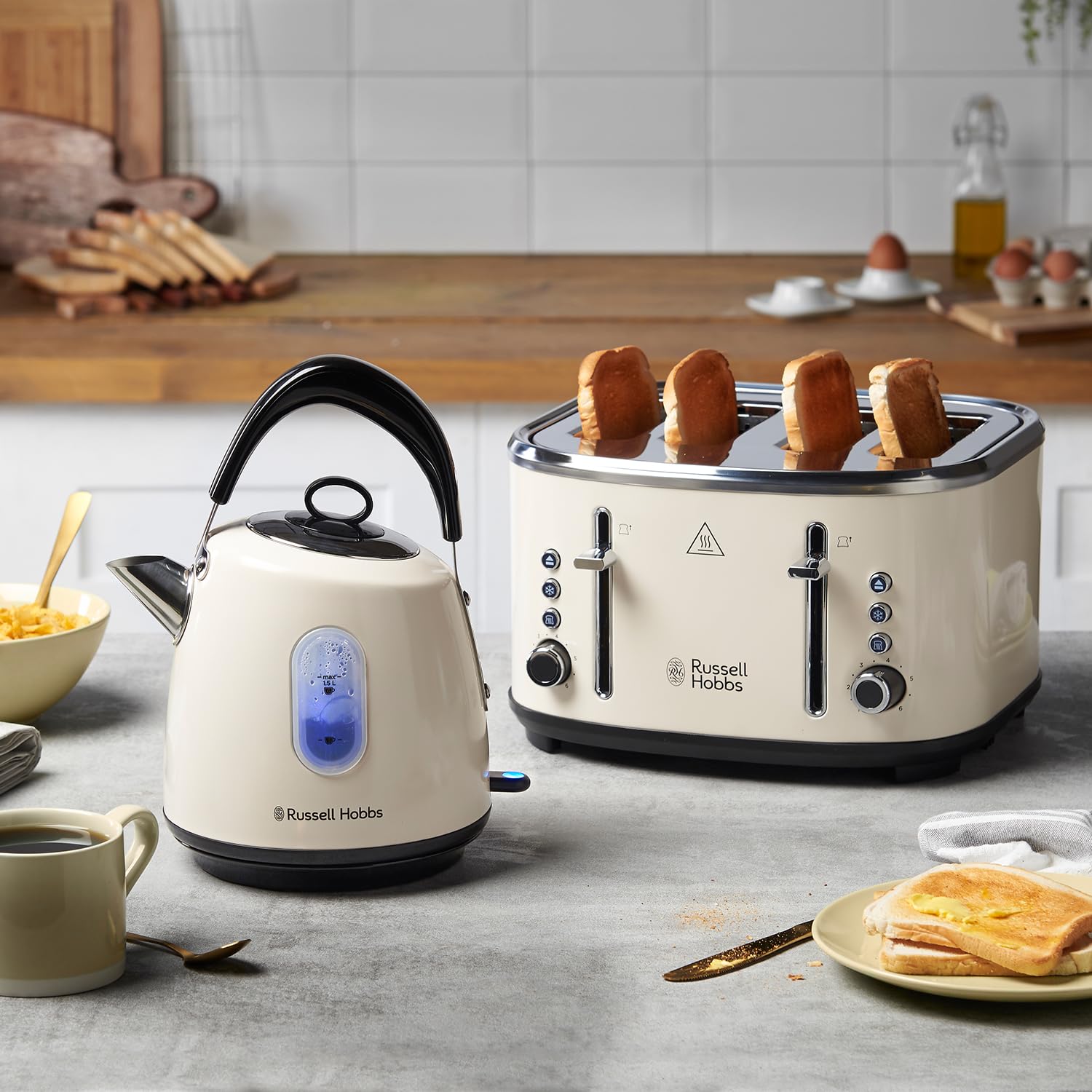Cream russell hobbs electric kettle with perfect pour spout blue display panel and black handle for fast boiling