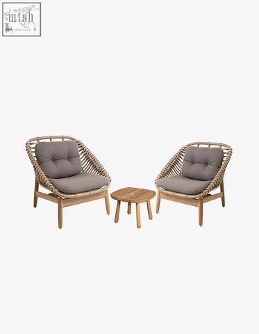 Pair of rustam modern outdoor wicker armchairs with gray cushions and wooden side table perfect for patio use