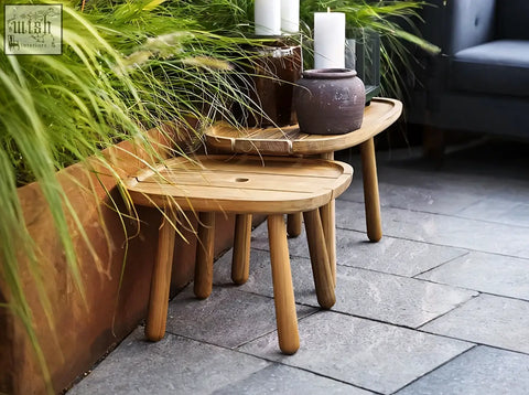Sturdy oval wooden nesting tables with smooth light wood slats and tapered legs in rustam modern outdoor set