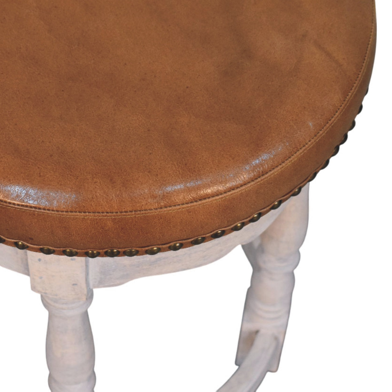 Rustic charm stool with brown leather top white painted legs and brass nailhead trim perfect for cozy seating