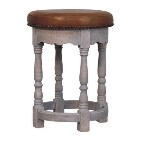 Rustic charm stool with gray wooden frame brown leather seat and brass nailhead trim for cozy seating