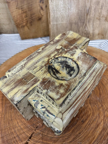 Weathered wooden rustic church candle holder with distressed yellow brown finish and oval black yellow design indian pillar base