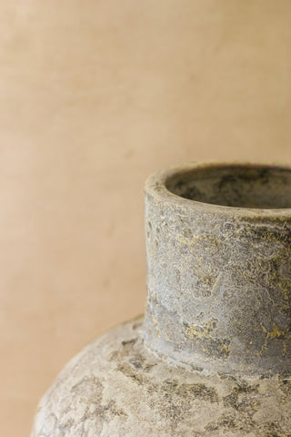 Rustic indonesian pot no 37 is a gray ceramic vase with a textured weathered finish and subtle greenish patina
