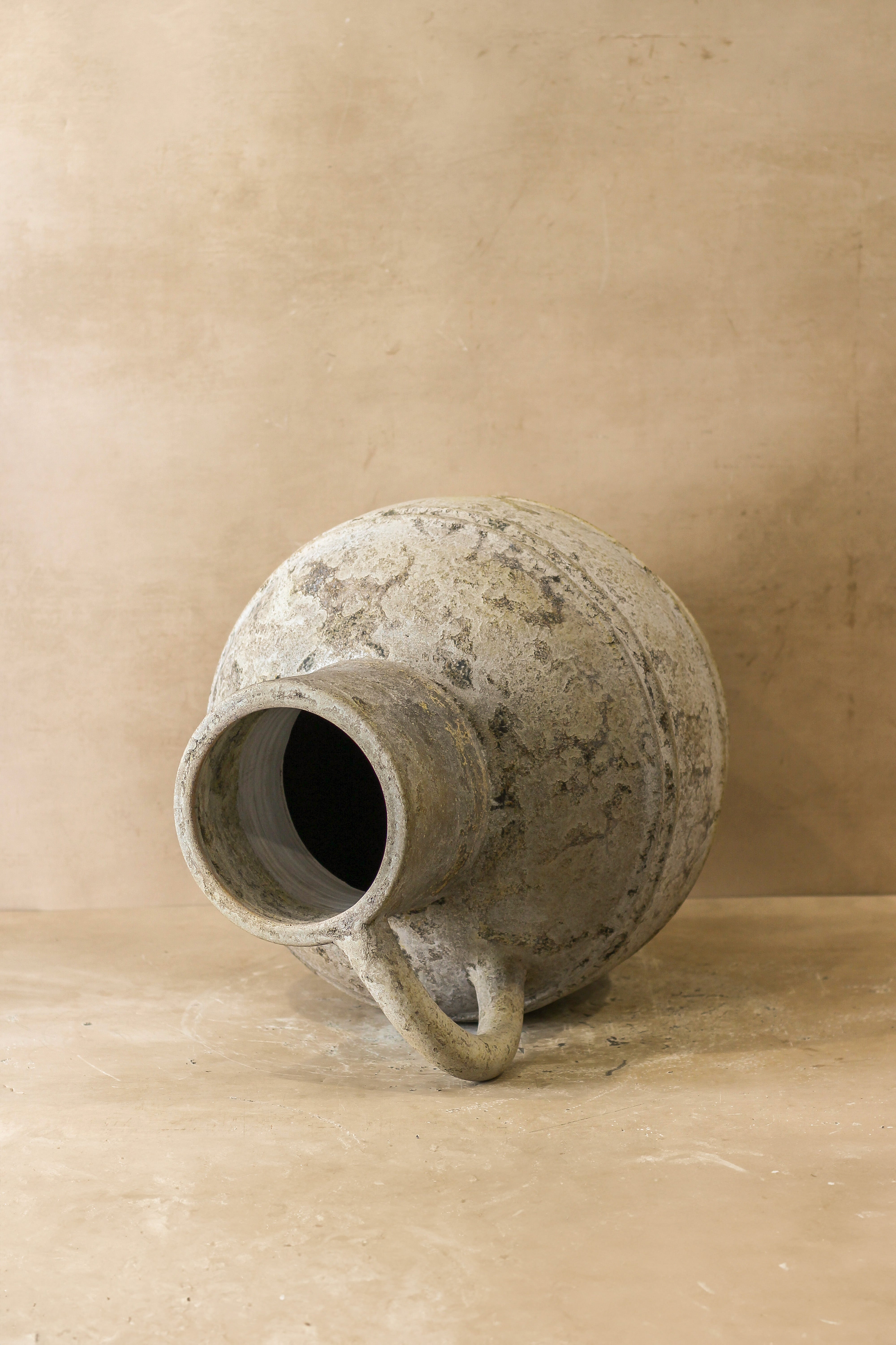 Rustic indonesian pot no 37 featuring a weathered matte ceramic jug with rustic texture and grayish brown tones