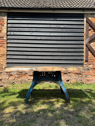 Blue painted metal industrial workbench with rustic solid ash top and cast iron base for kitchen island desk