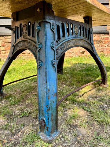 Blue painted cast iron base with ornate detailing and brixton england engraving for rustic kitchen island desk
