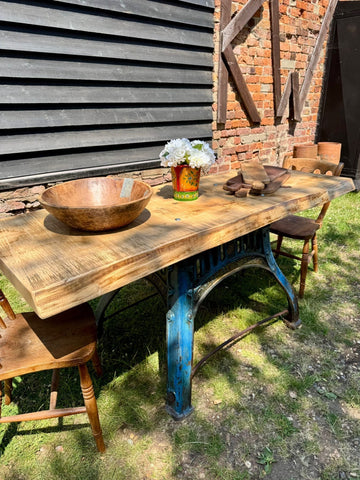 Rustic industrial kitchen island table with solid ash top and blue cast iron base for a stylish kitchen desk