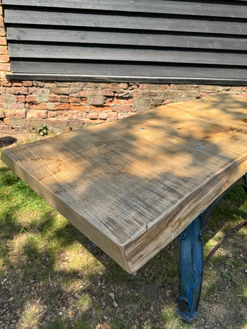 Rustic industrial table with solid ash top and blue cast iron base perfect for kitchen island desk or workspace