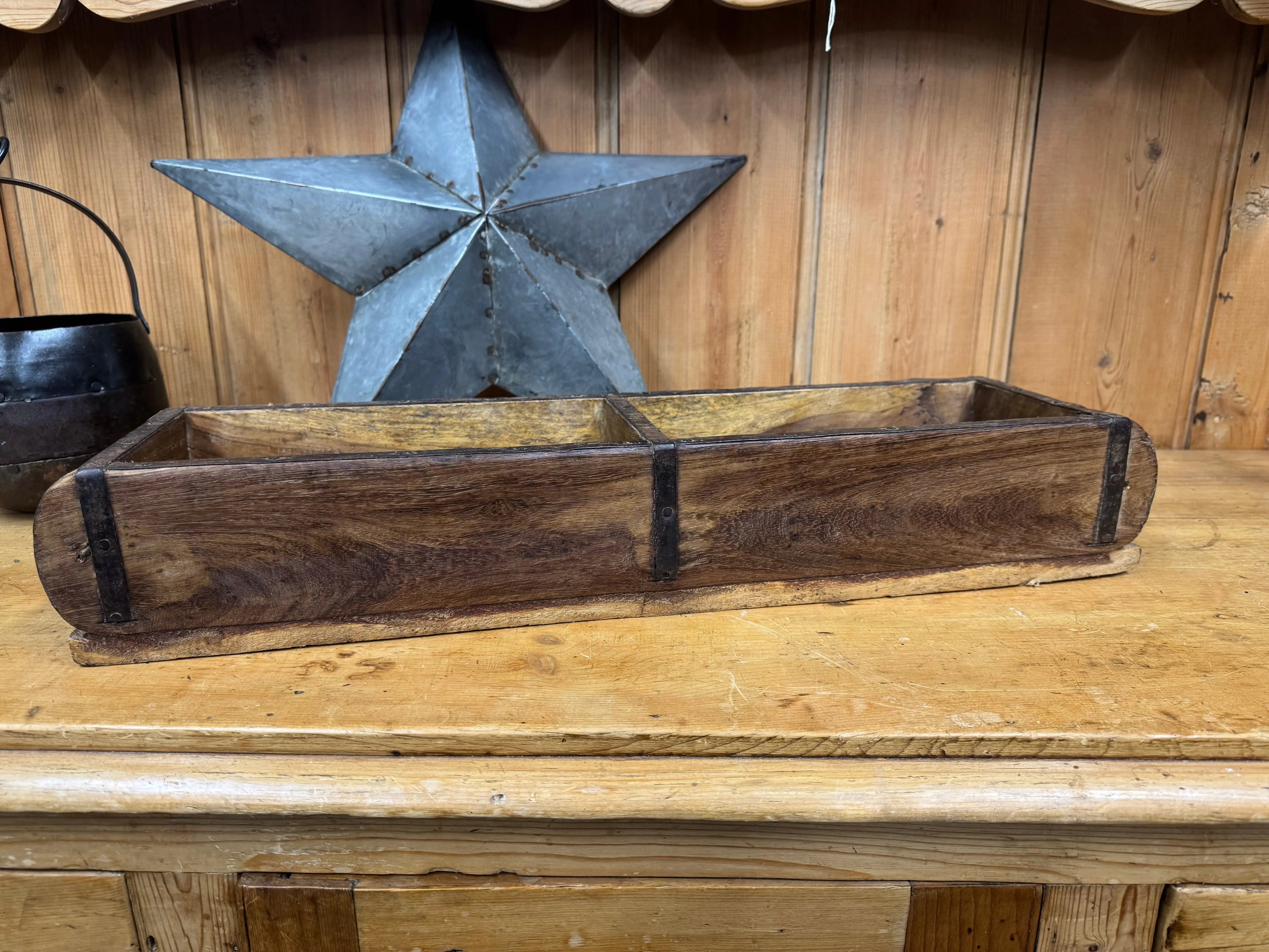 Rustic wooden double brick mould with dark brown weathered wood and black metal reinforcements for planting or storage
