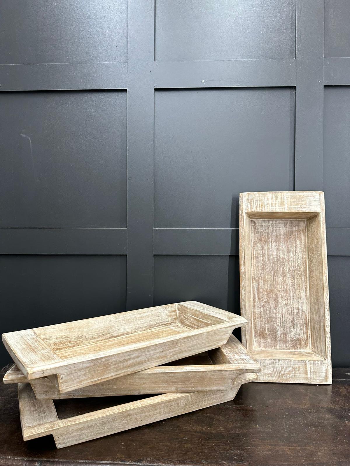Three rustic wooden serving trays with light weathered finish and visible wood grain for fruit bread or cheese board