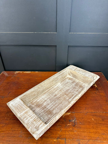 Rustic wooden serving tray with distressed white finish and visible wood grain for fruit bread cheese board use