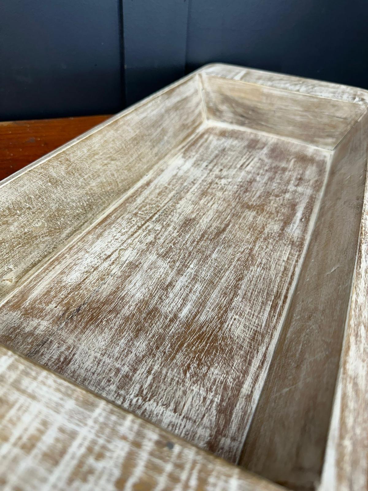Rustic whitewashed wooden serving tray with distressed finish and visible wood grain for fruit bread and cheese