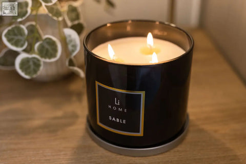 Black cylindrical 3 wick luxury candle in glass container with gold label sable from large candle collection