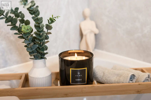 Black glass large candle jar with gold trim and lit wick from li home sable 3 wick luxury candle 1kg collection