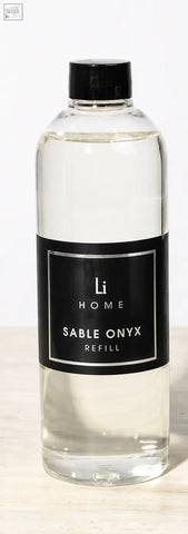Clear glass bottle with black cap containing transparent refill for sable onyx premium xxl diffuser in lifestyle home collection