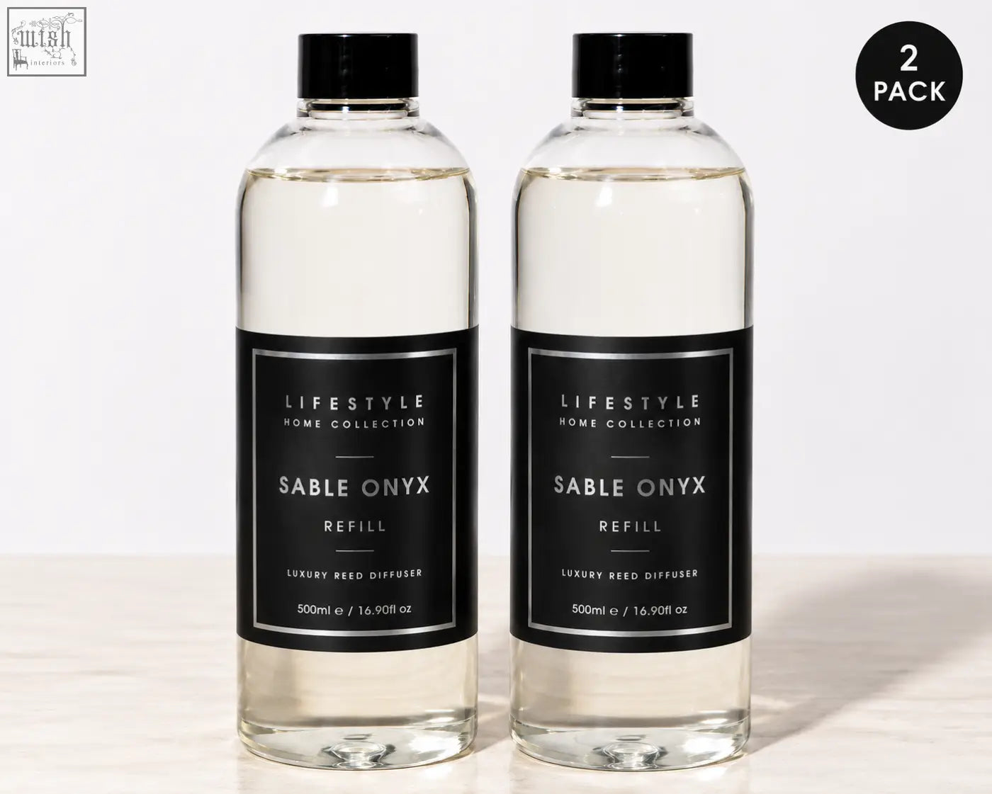 Two clear glass bottles with black caps and minimalist labels each holding 500ml premium xxl sable onyx diffuser refill