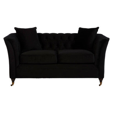 Black velvet tufted sabrina 2-seat onyx sofa with matching cushions and ornate gold-tone legs in a living room
